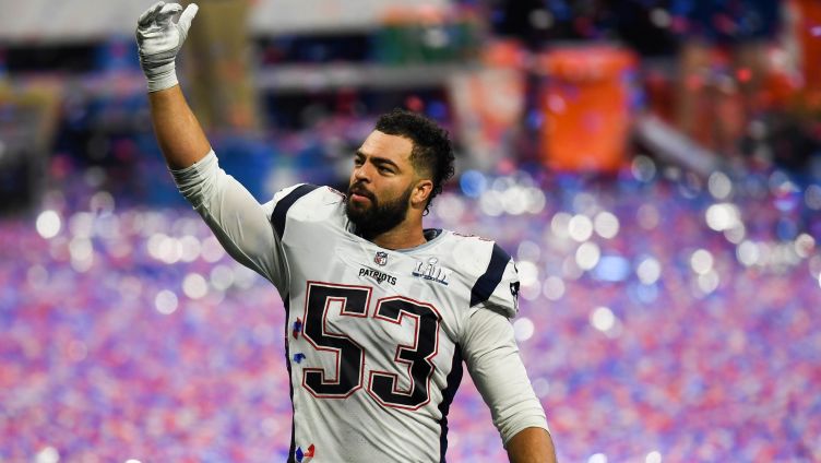 Professional football player Kyle Van Noy waving to the fans in a stadium